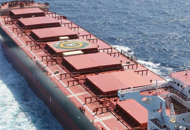 Closed hatch covers along the main deck of a Panamax bulk carrier